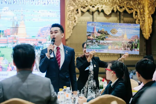 Phudit presenting Asian Plus Travel to an audience